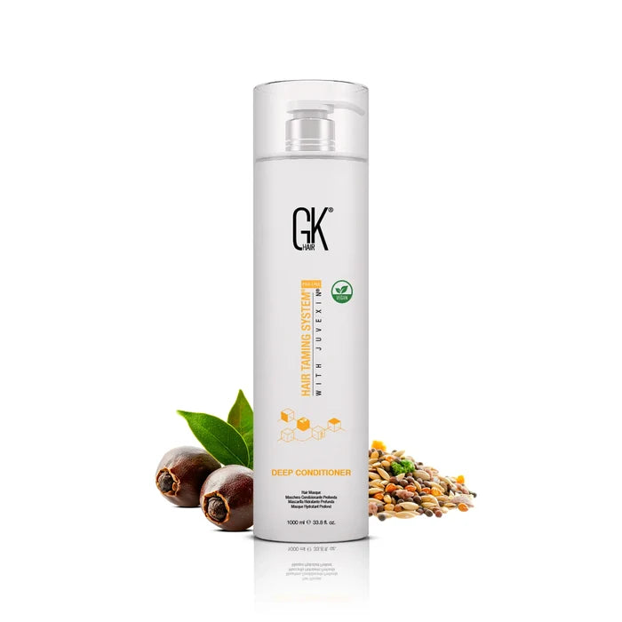 GK Hair Deep Conditioner hair masque 1000 ml white pump bottle with a vegan badge, beside jojoba nuts, green leaves and grains