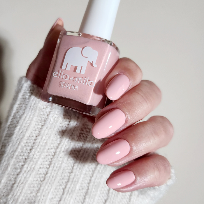 Get to the Pointe warm pink nail polish manicure on a light skin tone with a white sweater