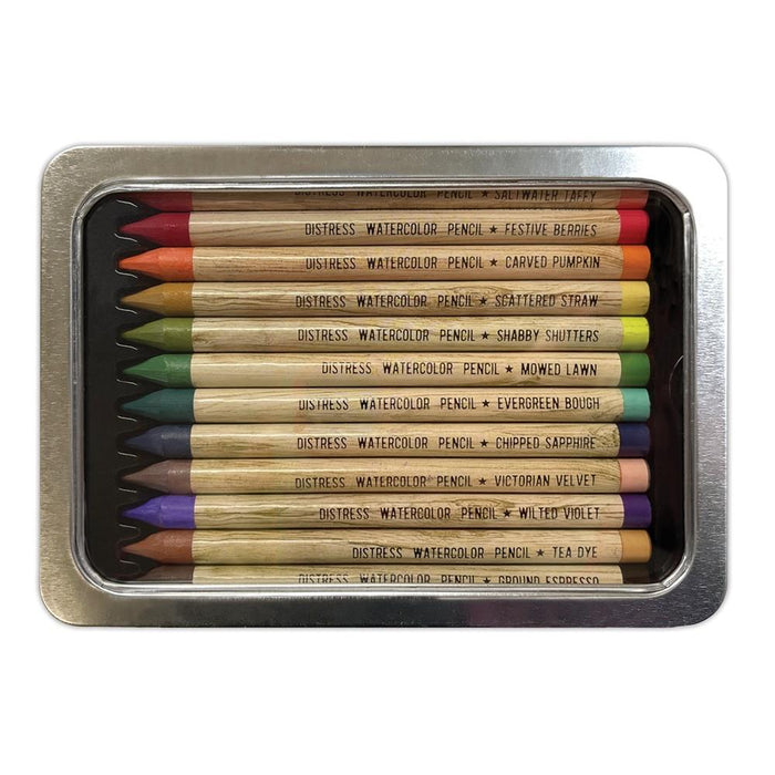 Tim Holtz - Distress Watercolor Pencils 12/Pkg Set 4. These are woodless watercolor pencils formulated to achieve vibrant coloring effects on porous surfaces. Water-reactive pigments are ideal for water coloring, shading, sketching, etc. Available at Embellish Away located in Bowmanville Ontario Canada.