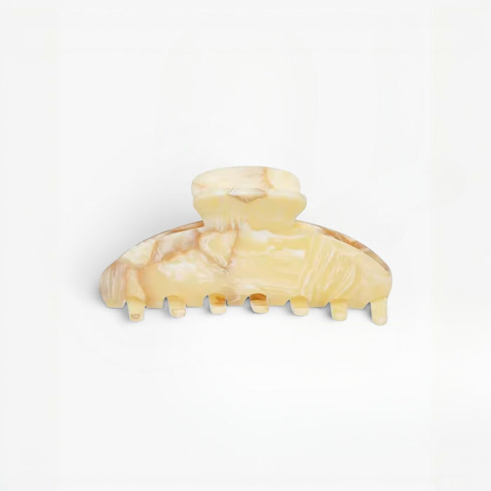 Beige hair clip on a white background