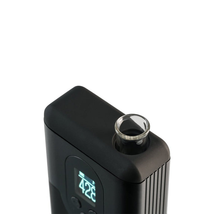 an electronic device with a glass on top of it