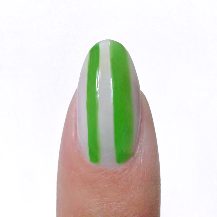 Artist Garden liner used for green vertical stripes on a sheer nude nail
