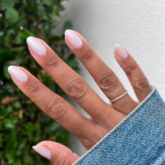 Atlas pearly white gel polish on natural nails with a soft pearlescent finish for a quick dry at-home manicure by Olive and June