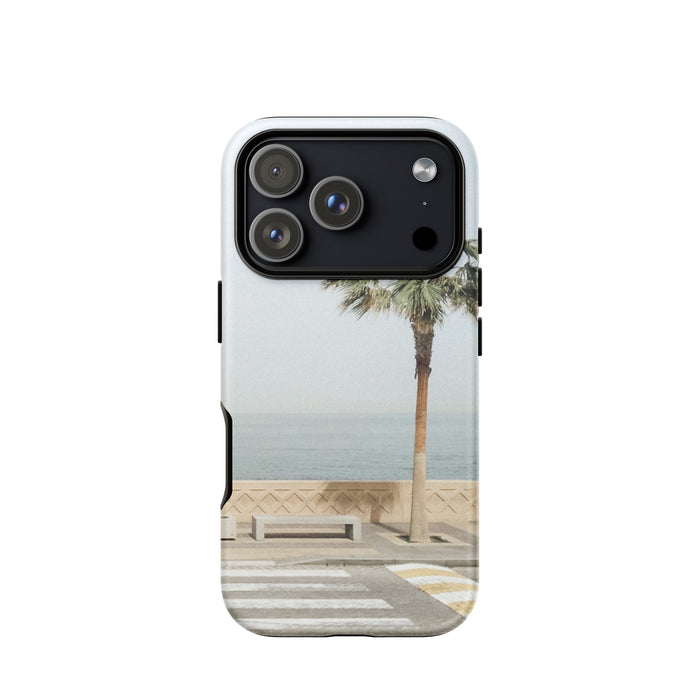 Phone case with palm tree and beach design on a white background