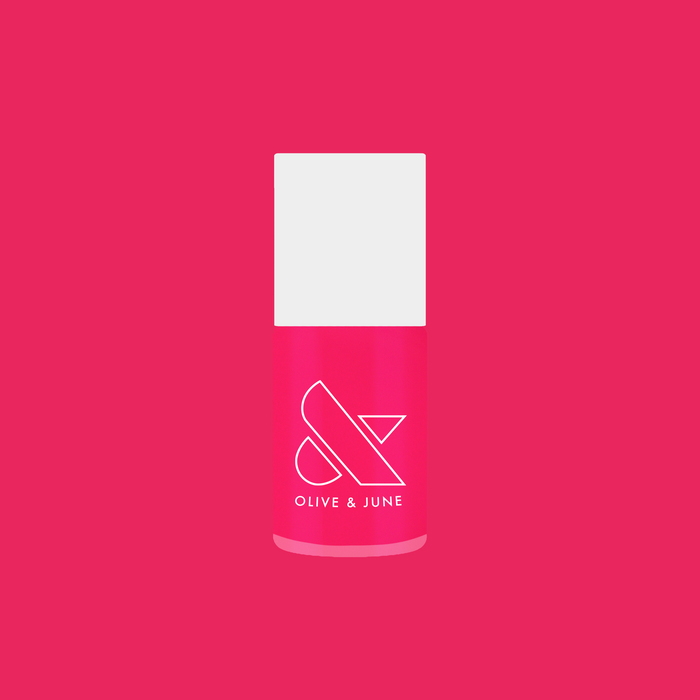 Bottle of Biggest Bow gel polish by Olive and June in bright magenta pink for at-home manicures and quick-dry polish
