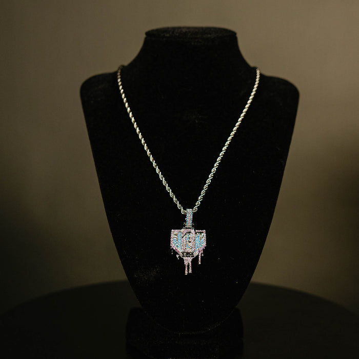 White Gold BL101 Drip Plate necklace hanging on a display stand against a black background