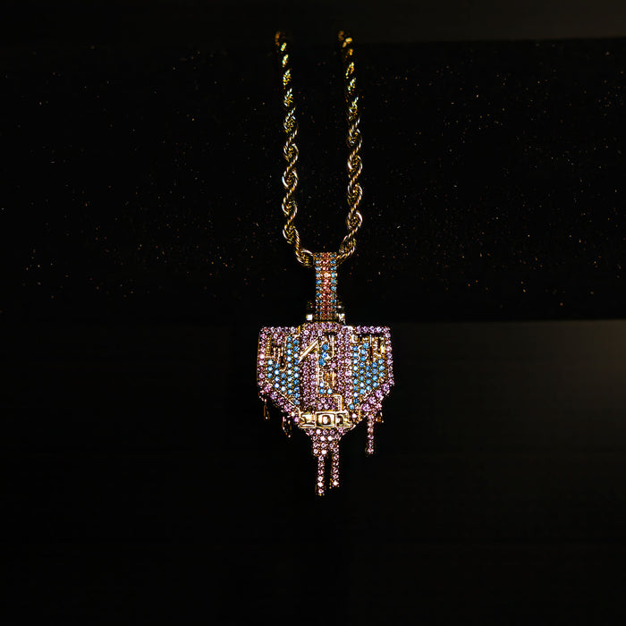 Yellow Gold BL101 Drip Plate necklace hanging on a display stand against a black background