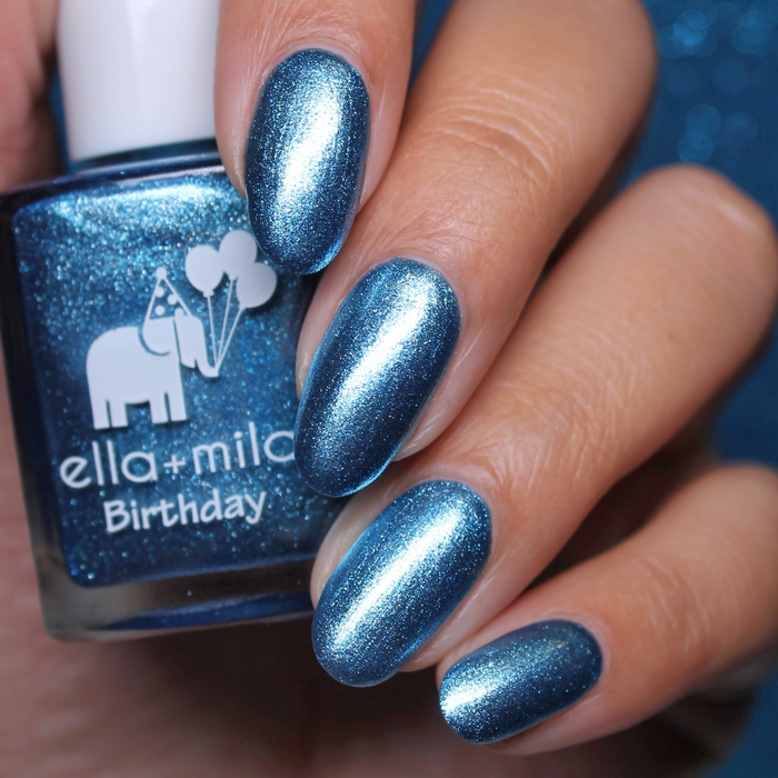 Blue Diamond Dream sparkly ice blue nail polish close-up with the bottle