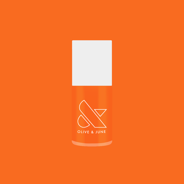 Bottle of Bounce Back nail polish in bright tangerine shade by Olive and June for quick-dry at home mani.