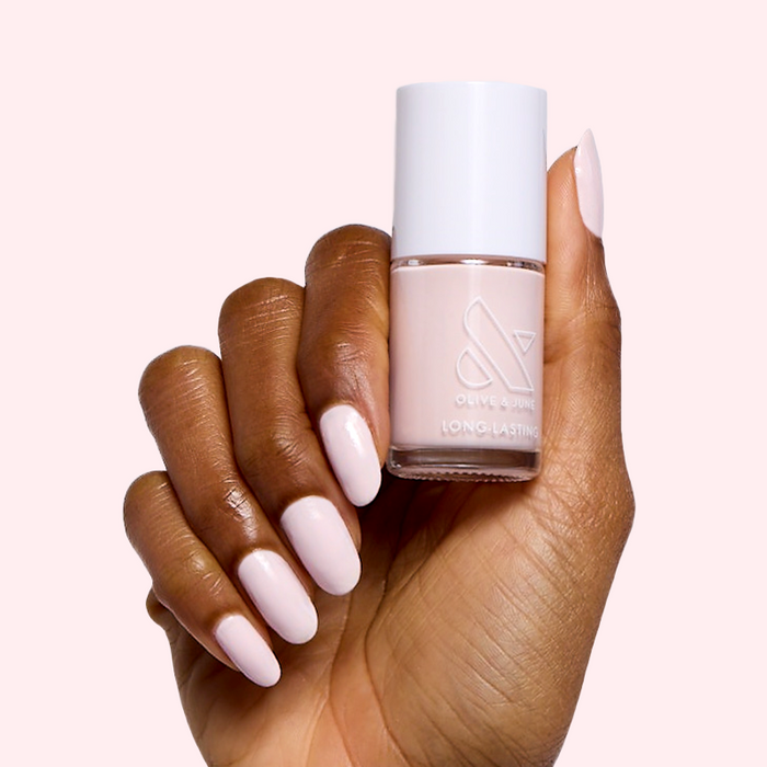 Brave Blush nail polish by Olive and June in soft pastel pink for a long-lasting, quick-dry at-home manicure