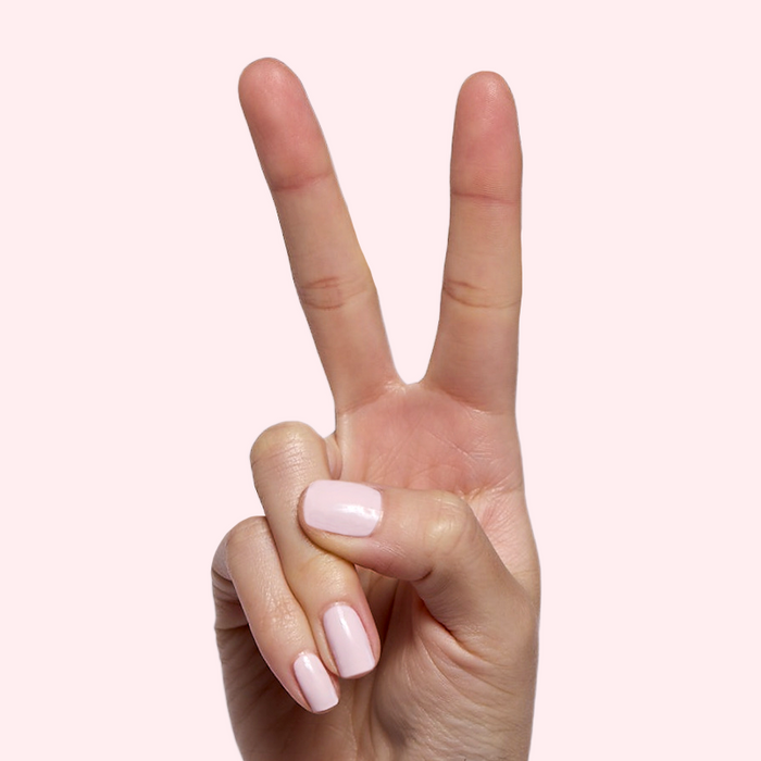 Brave Blush pastel pink polish on natural nails showing a smooth, glossy finish for easy at-home manicure looks