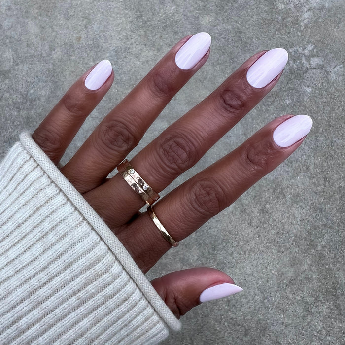 Brave Blush pastel pink nail polish on natural nails with a smooth finish for easy at-home manicures by Olive and June