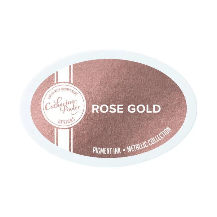 Catherine Pooler - Eau De Perfection - Ink Pad - Select from Drop Down. Crisp and bright and oh, so Platinum shine. Quartz is a slightly-muted, pale pink ink. The Rose Gold Metallic Pigment Ink is a rich, mauve-toned gold in with lots of shine. Available at Embellish Away located in Bowmanville Ontario Canada.