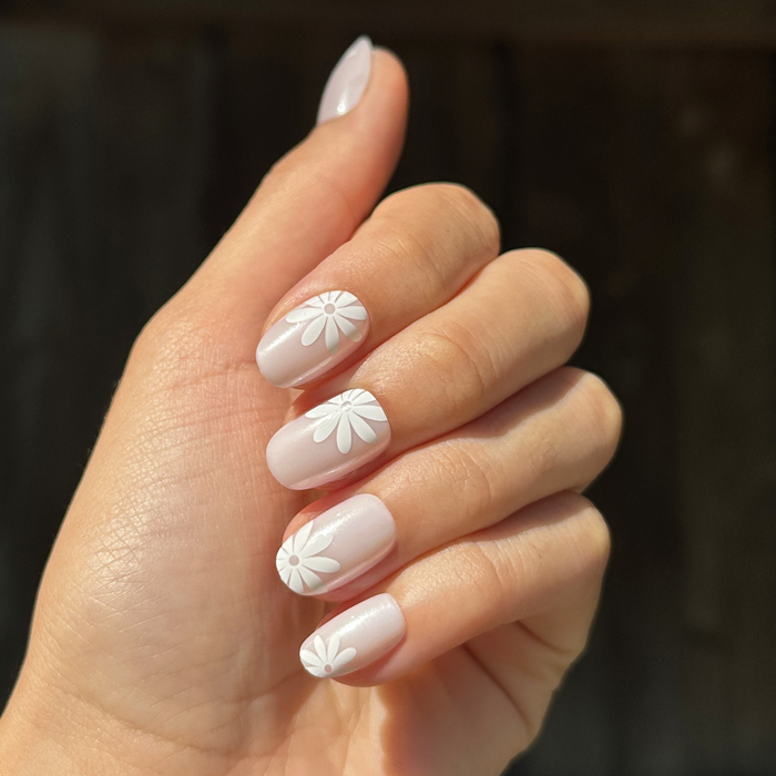 Chrome Daisy Pop - Press-On | Short | Round featuring soft neutral nails with large white floral details for easy at-home manicure