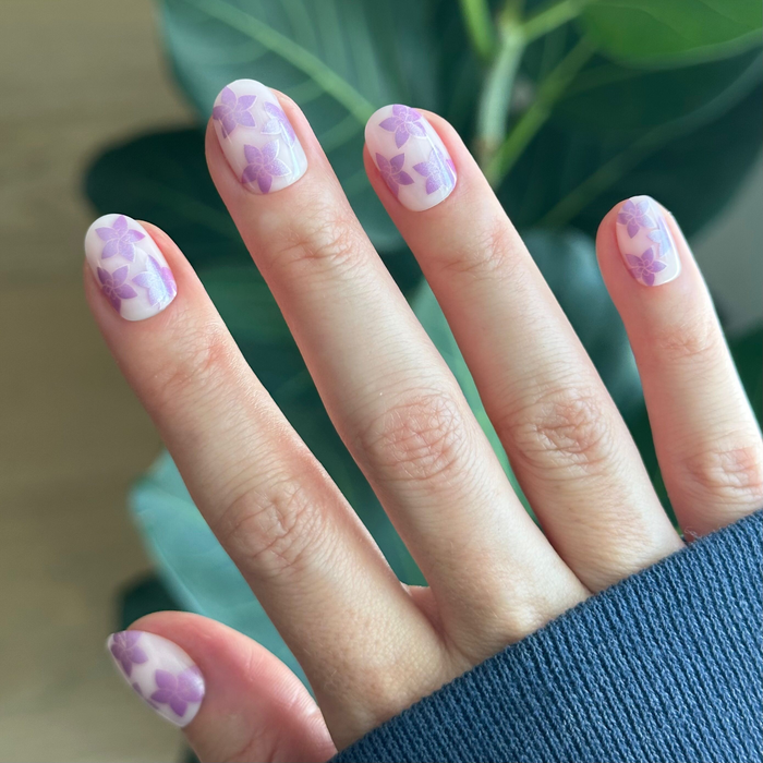 Chrome Petal Party - Press-On | Extra Short | Round neutral pink base with purple chrome floral design for at-home manicure