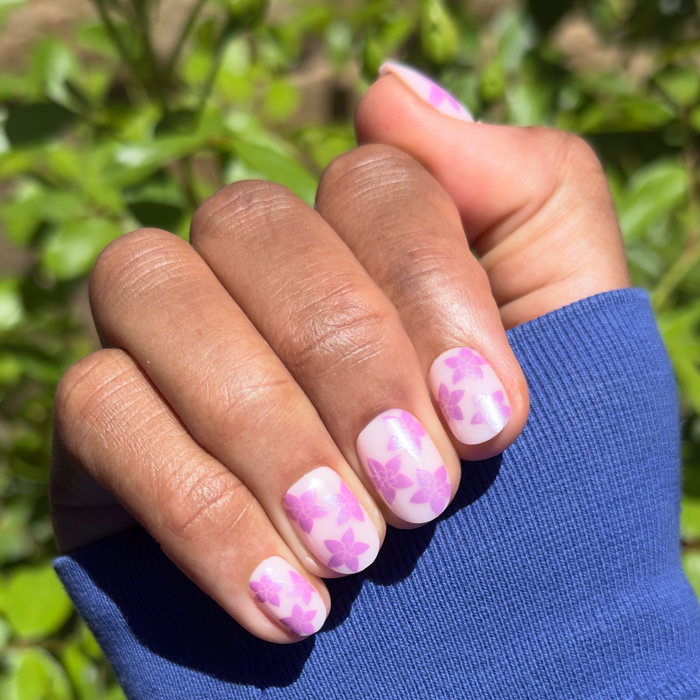 Chrome Petal Party - Press-On | Extra Short | Round neutral pink nails with purple chrome floral design for at-home mani