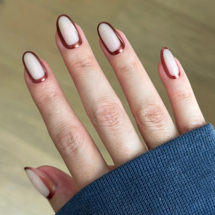 Cocoa Chrome Outline - Press-On | Medium | Oval neutral oval nails with chocolate chrome edging for a chic at-home manicure