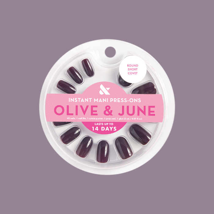 Pack of Covet - Press-On | Short | Round nails in a cool dark plum shade with Olive and June branding visible
