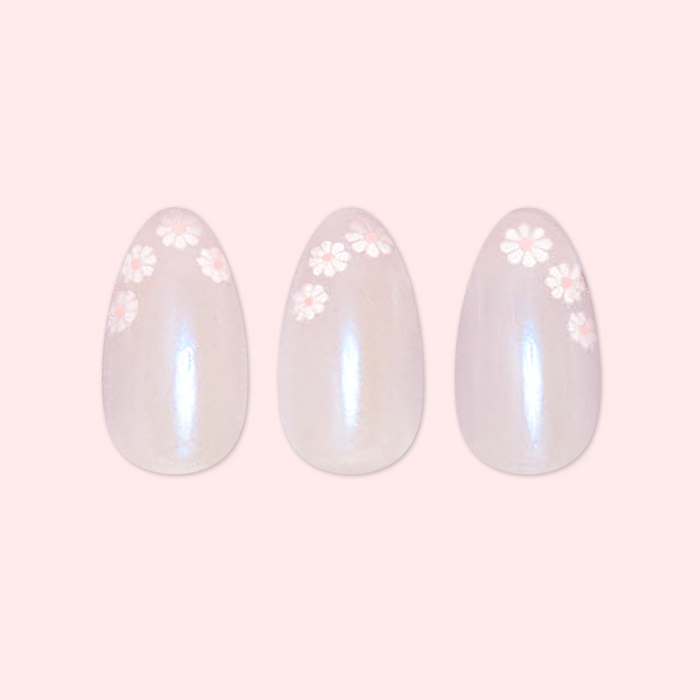 Daisy French - Press-On | Medium | Almond showing medium almond press-on nails with delicate white daisy details on soft pink background