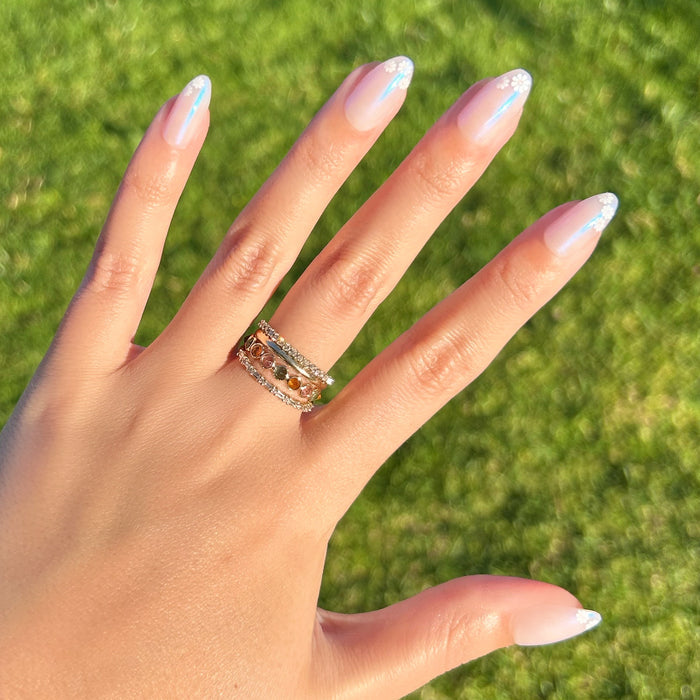 Daisy French - Press-On | Medium | Almond showing medium almond press-on nails with white daisy accents in natural sunlight outdoors