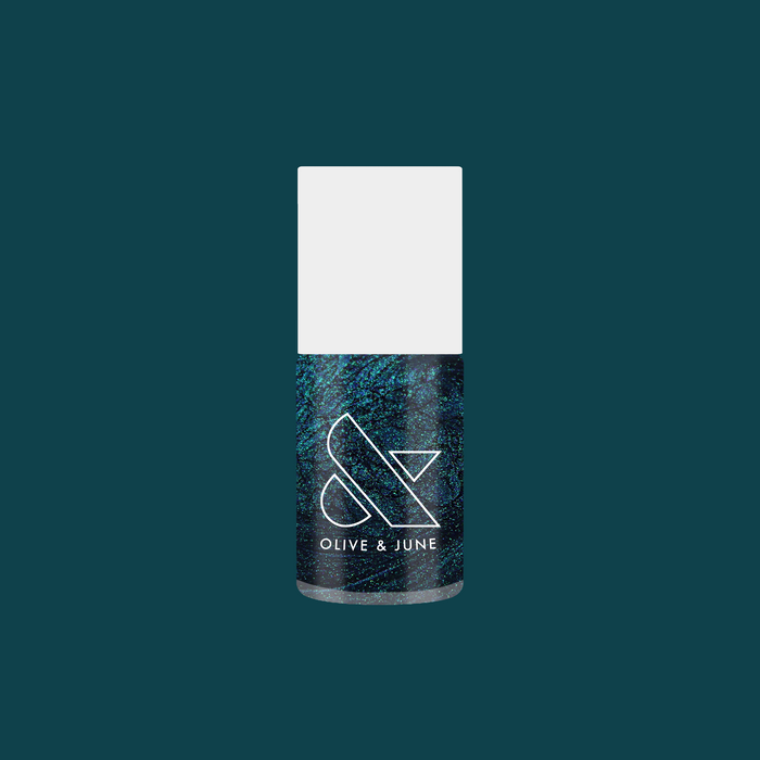 Olive and June Dancing Green nail polish bottle with deep emerald green shimmer for at-home manicure use