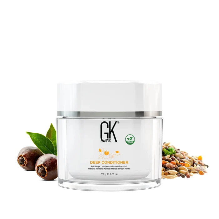 GK Hair Deep Conditioner 200 g jar with vegan icon centered on white, flanked by soapnuts, green leaves and mixed seeds