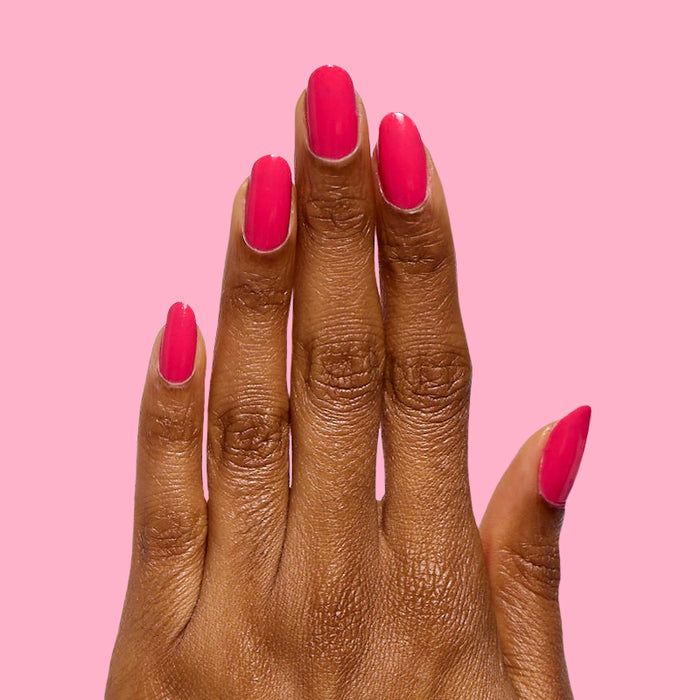Diner Date bright hot pink gel polish on natural nails with a glossy finish for a vibrant at-home manicure