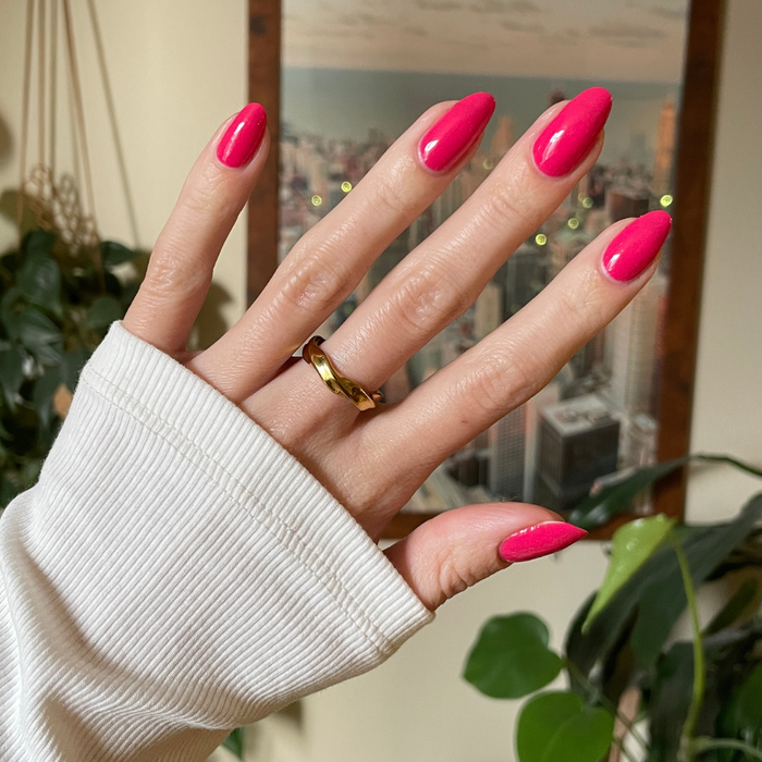 Diner Date bright hot pink gel polish on almond-shaped nails with a glossy finish for a quick at-home mani