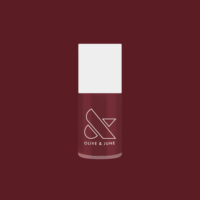 Olive and June polish bottle in Don’t Spill on the White Couch deep dusty berry red gel polish shade