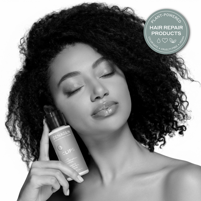 Model with natural textured hair holding Zenagen Eclipse color preservation shampoo, showcasing healthy-looking shine and hair vibrancy appearance.