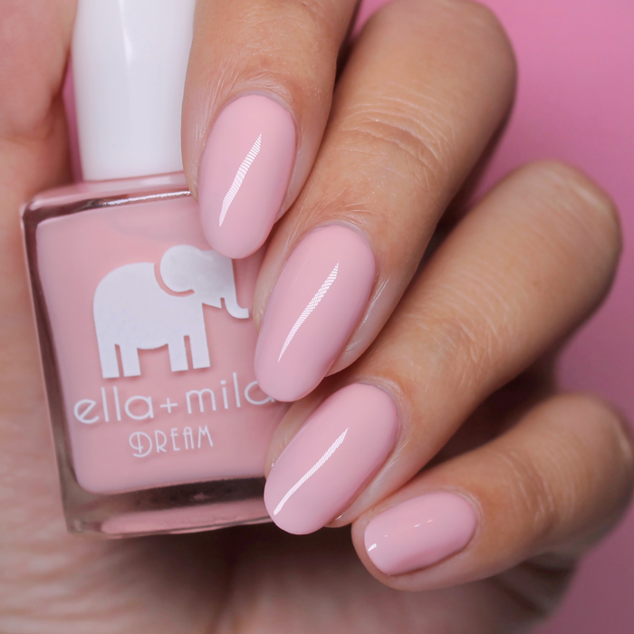 Get to the Pointe warm pink nail polish close-up with the bottle on a pink background