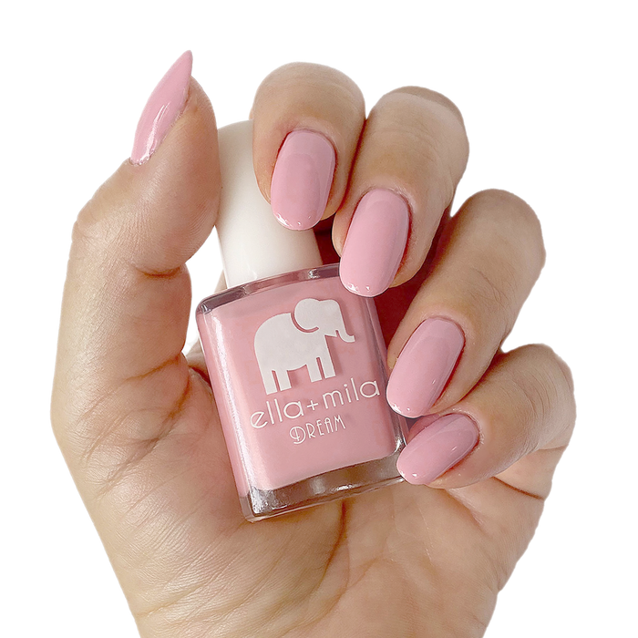 Get to the Pointe mid-toned pink nail polish manicure on a light skin tone with the bottle