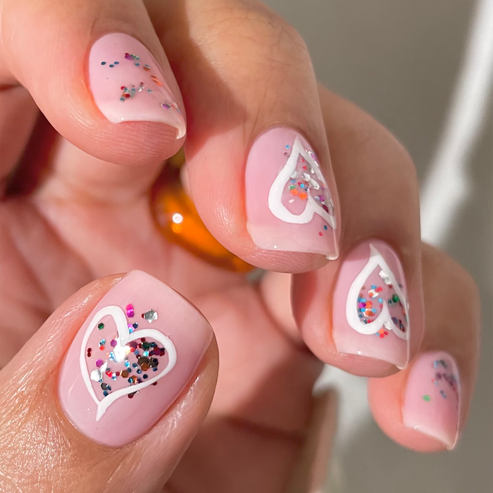 Get to the Pointe pink nail polish with heart and confetti accent nail art