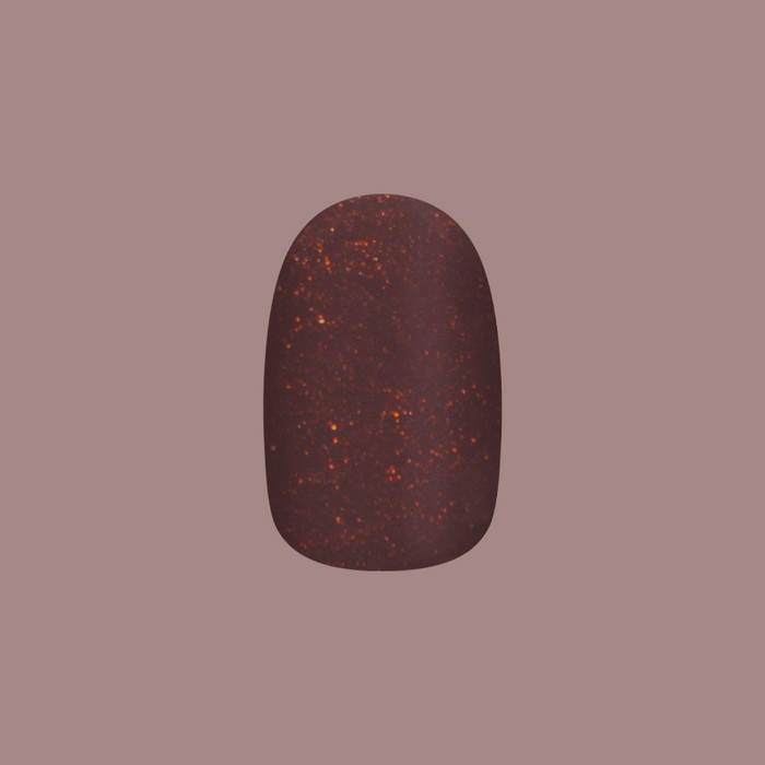 Single extra short round press-on nail in chocolatey neutral with golden shimmer from Goal Getter - Tab Press-On collection