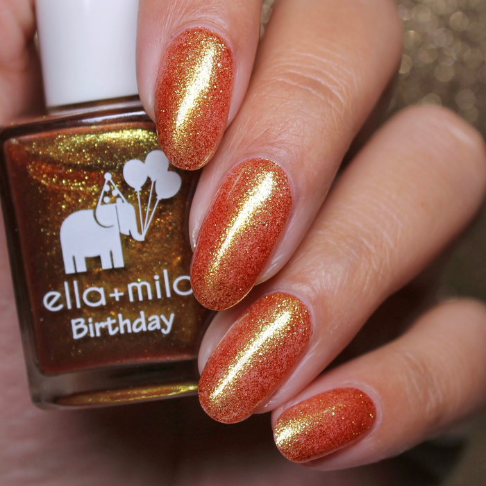 Heart of Gold gold micro glitter nail polish close-up with the bottle