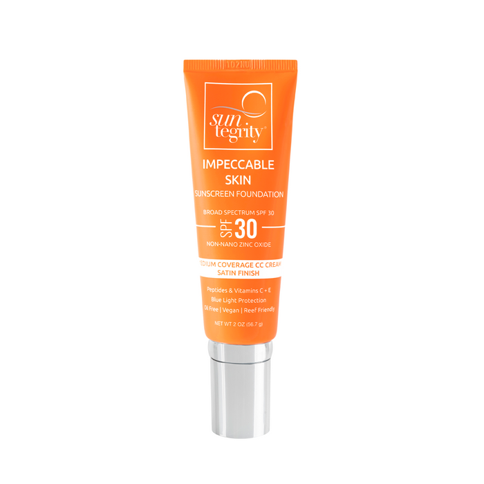 A bright orange tube of Suntegrity Impeccable Skin Medium Coverage CC Cream foundation with SPF 30