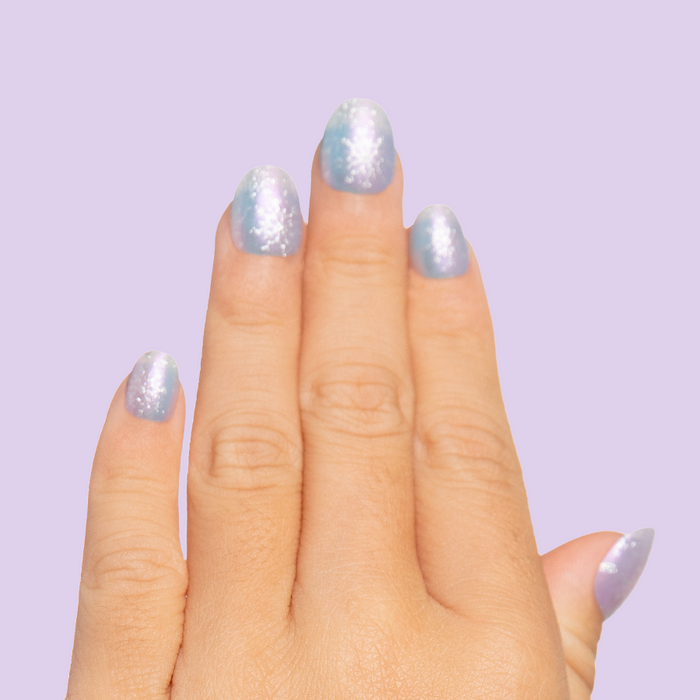 Iridescent Snow Queen - Pressies | Extra Short Short | Round showcasing shimmering snowflake mani on short round press-on nails