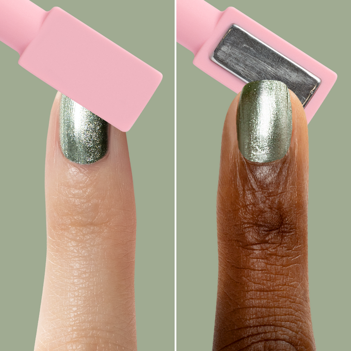 Fingers with Jade Velvet green magnetic polish showing shimmer effects using a pink rectangular magnetic tool for at-home mani