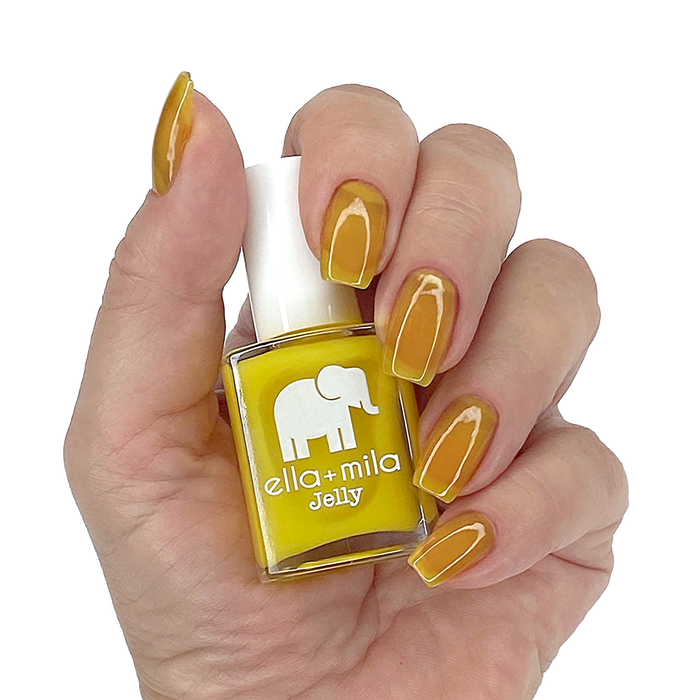 Lemon Drop sheer yellow jelly nail polish manicure on a light skin tone with the bottle