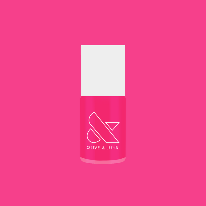 Bright hot pink Love All nail polish bottle by Olive and June for quick-dry, long-lasting at-home manicure looks