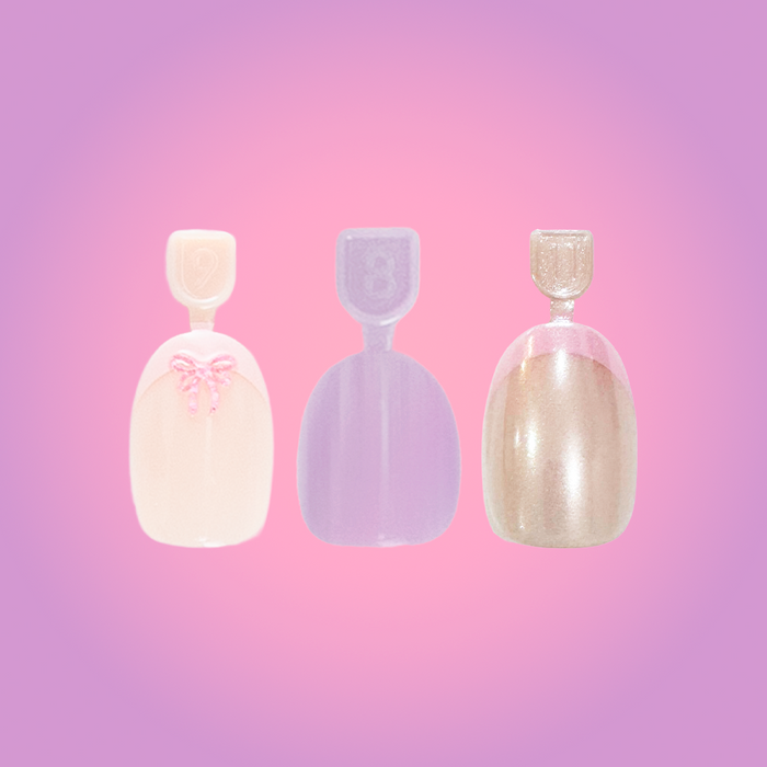 Mani Party Pressie Trio showing three press-on nails with solid, shimmer, and 3D bow design in soft pastel colors