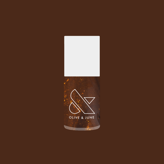 Bottle of Milk Chocolate gel polish showing golden iridescent shimmer on deep milky brown background