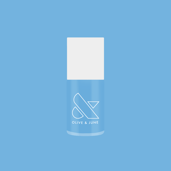 Bottle of Not a Cloud quick dry gel polish in bright azure blue for vibrant at home manicures by Olive and June