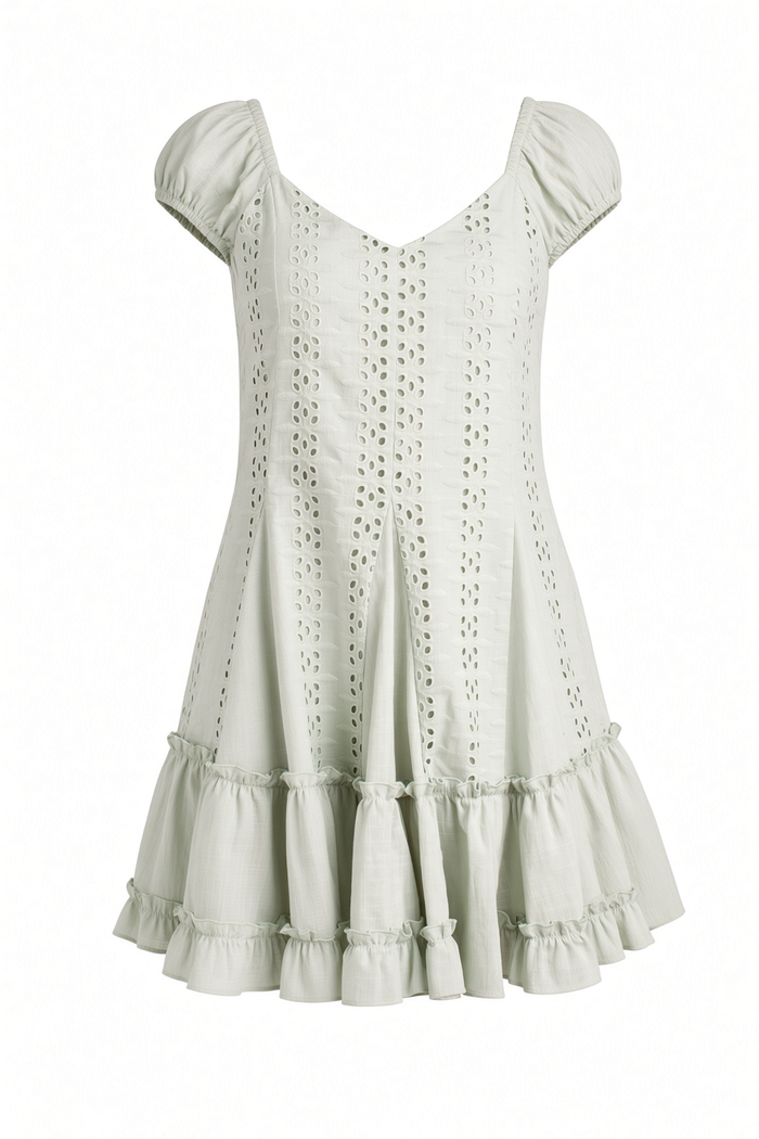A light sage green eyelet mini dress with puff sleeves, a V-neckline, and tiered ruffle hem, shown against a plain white background.