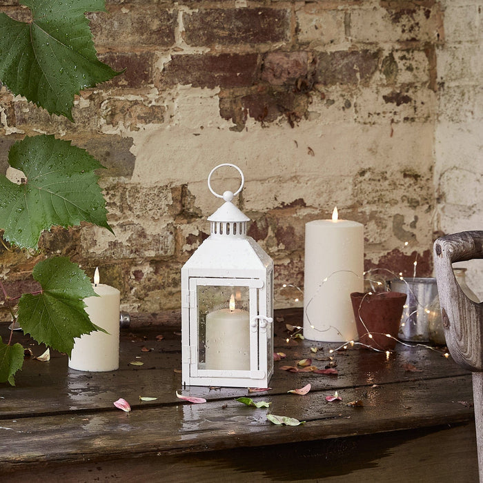 LA20016_perth-white-garden-lantern-with-truglow-candle-outside.jpg
