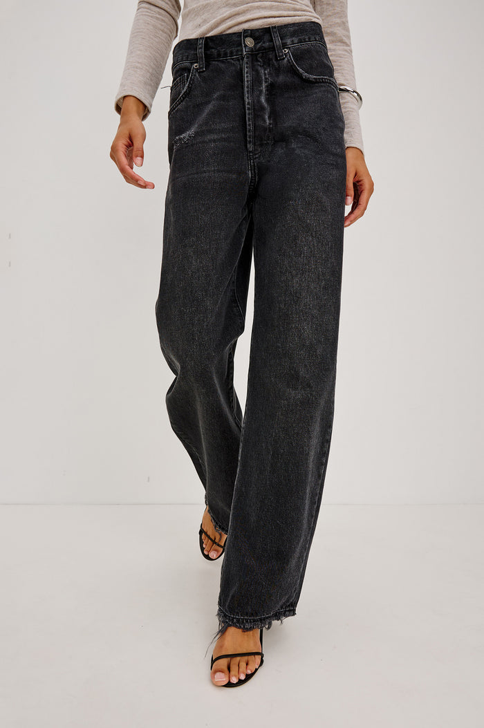 Belmont Petite Arc Leg Jean in Rigid Denim With High Rise, Distressed Detailing, Button Fly, and 5-Pockets in Nightcap Colorway - Lower Body Front View Featured on Model