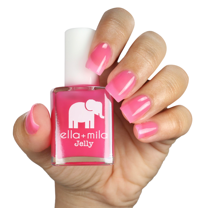 Pink Sand Beach sheer pink jelly nail polish manicure on a light skin tone with the bottle