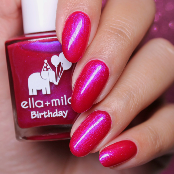 Pink Sapphire iridescent pink purple nail polish close-up with the bottle