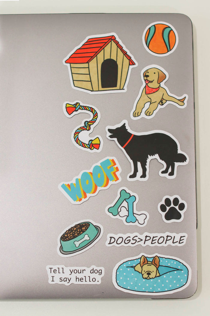 orange and teal ball, red roof dog house, golden lab, "tell your dog I say hello", rope dog toy, black dog, "woof", black paw print, teal dog food bow, white blue and teal bone, "dogs > people", frechie dog in