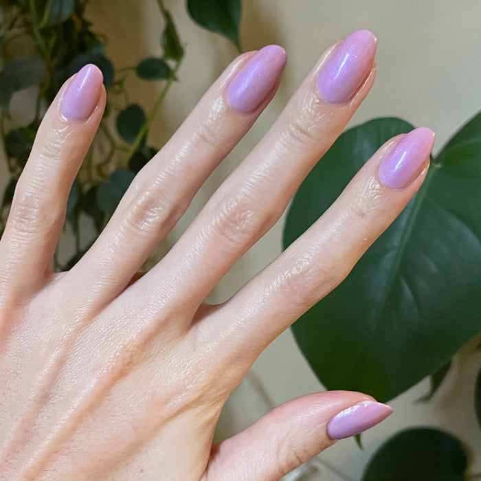 Purple Season manicure with soft shimmering lavender gel polish on natural nails for a smooth, glossy finish by Olive and June